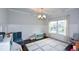 Bright playroom features a large window, coffered ceiling, and plenty of storage at 302 Aspen Valley Ln, Dallas, GA 30157
