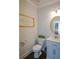 Elegant powder room featuring marble vanity top and neutral decor at 302 Aspen Valley Ln, Dallas, GA 30157