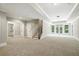 Spacious finished basement with carpet, staircase, and double doors leading outside at 400 Mabry Pl, Atlanta, GA 30319