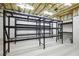 Unfinished basement with exposed ceiling and metal shelving for storage at 400 Mabry Pl, Atlanta, GA 30319