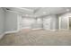 Finished basement with carpet flooring, access to bathroom, and bonus room behind half wall at 400 Mabry Pl, Atlanta, GA 30319