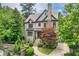 Charming home featuring a stone chimney, brick accents, and a well-manicured lawn at 400 Mabry Pl, Atlanta, GA 30319