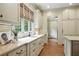 Classic kitchen design featuring custom cabinetry, granite countertops, hardwood floors, and modern appliances at 400 Mabry Pl, Atlanta, GA 30319