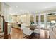 Bright eat-in kitchen with island, stainless appliances, granite countertops, and access to covered terrace at 400 Mabry Pl, Atlanta, GA 30319