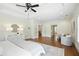 Expansive main bedroom with hardwood floors, tray ceiling, recessed lights, and multiple entrances at 400 Mabry Pl, Atlanta, GA 30319