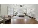 Spacious main bedroom boasts a tray ceiling, large windows with shutters, and an elegant seating area at 400 Mabry Pl, Atlanta, GA 30319