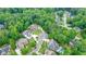 Picturesque aerial view of suburban homes surrounded by dense forest at 6017 Chestatee Creek Nw Ct, Acworth, GA 30101