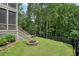 Backyard featuring a stone fire pit and a lush green surroundings at 6017 Chestatee Creek Nw Ct, Acworth, GA 30101