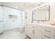 Modern bathroom with glass shower, mosaic tile accents, and a vanity with ample storage and a large mirror at 6017 Chestatee Creek Nw Ct, Acworth, GA 30101