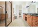 Spacious bathroom features a double vanity, glass shower and soaking tub at 6017 Chestatee Creek Nw Ct, Acworth, GA 30101
