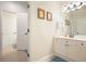 Bright bathroom with white cabinets, neutral walls, a big mirror, tile flooring, and nice decorative touches at 6017 Chestatee Creek Nw Ct, Acworth, GA 30101