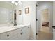 Modern bathroom featuring sleek white cabinets and view into a bedroom at 6017 Chestatee Creek Nw Ct, Acworth, GA 30101