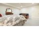 Cozy bedroom features neutral carpeting, a ceiling fan, and a comfortable seating area at 6017 Chestatee Creek Nw Ct, Acworth, GA 30101