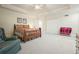 Bright bedroom with tray ceiling, a double bed, and white closet doors at 6017 Chestatee Creek Nw Ct, Acworth, GA 30101