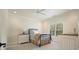Comfortable bedroom with ceiling fan, window, and neutral decor for a cozy and relaxing atmosphere at 6017 Chestatee Creek Nw Ct, Acworth, GA 30101