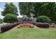 Stone Chestatee Creek community sign surrounded by colorful landscaping at 6017 Chestatee Creek Nw Ct, Acworth, GA 30101