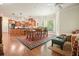 Open concept layout with kitchen, dining, and living area, lots of windows, hardwood floors and granite countertops at 6017 Chestatee Creek Nw Ct, Acworth, GA 30101
