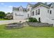Charming brick home featuring manicured lawn, stone retaining wall, and attached two-car garage at 6017 Chestatee Creek Nw Ct, Acworth, GA 30101