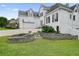 Stately white home with a manicured lawn, stone retaining wall, and American flag, set on a well-maintained property at 6017 Chestatee Creek Nw Ct, Acworth, GA 30101