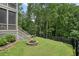 Outdoor area with a stone fire pit, perfect for relaxing and enjoying the backyard at 6017 Chestatee Creek Nw Ct, Acworth, GA 30101