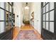 Inviting foyer with hardwood floors, chandelier, and elegant details, creating a grand entrance at 6017 Chestatee Creek Nw Ct, Acworth, GA 30101