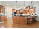 Kitchen showcasing wood cabinets, granite countertops, and stainless steel appliances at 6017 Chestatee Creek Nw Ct, Acworth, GA 30101