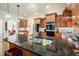 Modern kitchen with a granite countertop island and stainless steel appliances at 6017 Chestatee Creek Nw Ct, Acworth, GA 30101