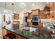 Kitchen with wood cabinets, granite countertops, and stainless steel appliances at 6017 Chestatee Creek Nw Ct, Acworth, GA 30101