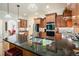 Kitchen island features granite countertops, stainless steel appliances and wood cabinets at 6017 Chestatee Creek Nw Ct, Acworth, GA 30101