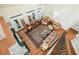 Bright and airy living room featuring hardwood floors, vaulted ceilings, and multiple seating areas at 6017 Chestatee Creek Nw Ct, Acworth, GA 30101
