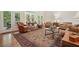 Spacious living room with hardwood floors and french doors leading to the porch at 6017 Chestatee Creek Nw Ct, Acworth, GA 30101