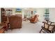 Bright, airy living room features a fireplace and large windows at 6017 Chestatee Creek Nw Ct, Acworth, GA 30101