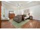Serene main bedroom features hardwood floors, natural light, and a seating area at 6017 Chestatee Creek Nw Ct, Acworth, GA 30101