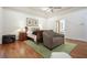 Comfortable main bedroom with hardwood floors, tray ceiling, and access to the ensuite bathroom at 6017 Chestatee Creek Nw Ct, Acworth, GA 30101