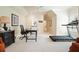 Bright home office featuring neutral walls, ceiling fan, and exercise equipment at 6017 Chestatee Creek Nw Ct, Acworth, GA 30101
