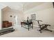 Bright office with a desk, gym equipment, and plush carpeting at 6017 Chestatee Creek Nw Ct, Acworth, GA 30101