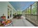 Expansive screened porch with multiple seating areas and views at 6017 Chestatee Creek Nw Ct, Acworth, GA 30101