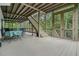Spacious screened porch with stairs to backyard, offering an ideal spot for outdoor living and entertaining at 6017 Chestatee Creek Nw Ct, Acworth, GA 30101