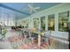 Spacious screened-in porch with a large dining table and access to the outdoors at 6017 Chestatee Creek Nw Ct, Acworth, GA 30101