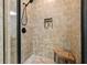 The primary bath includes a tile shower with a built in bench and shower caddy at 6017 Chestatee Creek Nw Ct, Acworth, GA 30101