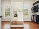Walk in closet featuring hardwood floors, natural light and shelving at 6017 Chestatee Creek Nw Ct, Acworth, GA 30101