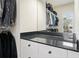 Walk-in closet features ample shelving and granite counter space at 6017 Chestatee Creek Nw Ct, Acworth, GA 30101