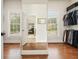 Large walk-in closet with window and built-in organizer at 6017 Chestatee Creek Nw Ct, Acworth, GA 30101