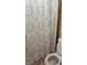 Bathroom featuring a toilet with a patterned shower curtain in the background at 80 Place Fontaine, Lithonia, GA 30038