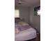 Standard bedroom featuring a comfortable bed, natural light, and a modern television at 80 Place Fontaine, Lithonia, GA 30038