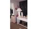 Bedroom featuring a sleek white desk with modern decor, luggage, and an inspiring chalkboard wall at 80 Place Fontaine, Lithonia, GA 30038