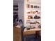 Living room displaying a built-in bookcase with decor items, books, and a glimpse of a walk-in closet at 80 Place Fontaine, Lithonia, GA 30038
