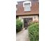 Exterior of the building featuring a walkway, green landscaping, and dark brown entryway at 80 Place Fontaine, Lithonia, GA 30038