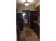 Efficient kitchen with modern appliances, sleek dark cabinets, and a view leading to other rooms at 80 Place Fontaine, Lithonia, GA 30038
