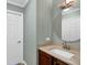 Bathroom includes a vanity with granite countertop, round mirror and a neutral wall color at 1875 Edgemont Ct, Cumming, GA 30041